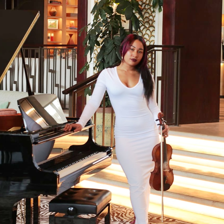 Estée with her acoustic violin